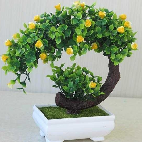 Plastic bonsai with fake flowers